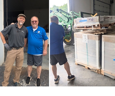 Got Electric’s Randy Velker, left, and community supporter Mike Gantt assist with the delivery of 57 solar panels donated to Shenandoah County SEARCH Inc.