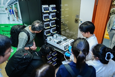 Photo shows guests taking a closer look at the CL1 biological computing system during a live demonstration at the launch event. Photo shows guests taking a closer look at the CL1 biological computing system during a live demonstration at the launch event.
