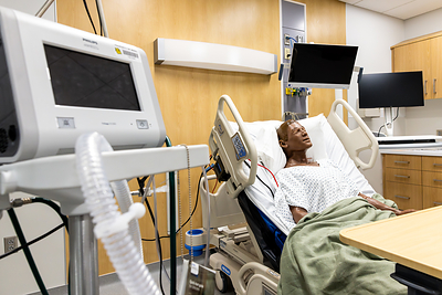 The center includes a simulated hospital designed to replicate a variety of clinical environments, including a neonatal intensive care unit, labor and delivery rooms, acute and critical care areas, and X-ray and CT imaging suites.