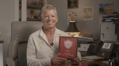 Tina Reed Accepts The 2026 Leadership in Incident Response Award.