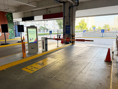 Automated parking entrance and exit lanes at SM Southmall, featuring SynerPark’s digital signage and FETCi’s ALPR-based access control.