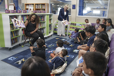 Author Seina Wedlick reading to children at the event.