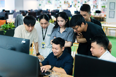 Saigon Technology engineers reviewing an AI-assisted build together