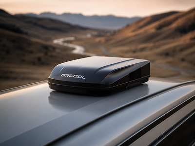 Close-up of the New 15K BTU MRCOOL® TravelCool™ system in black. Top view of RV traveling in an extreme desert climate.