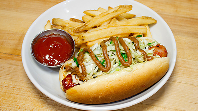 Mill City’s Gochujang SPAM® Dog: A grilled SPAM® Dog glazed with gochujang, topped with crunchy scallion slaw, Thai peanut drizzle and served with fries