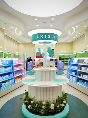 The AXIS-Y Brand House display at Korea Town by Boutiqaat in Kuwait featuring the brand's signature colors and motifs alongside its skincare products