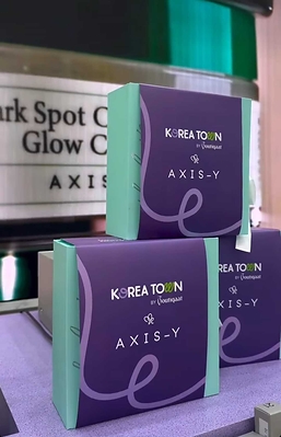 AXIS-Y product packaging is displayed at the Korea Town by Boutiqaat launch activation event in Kuwait