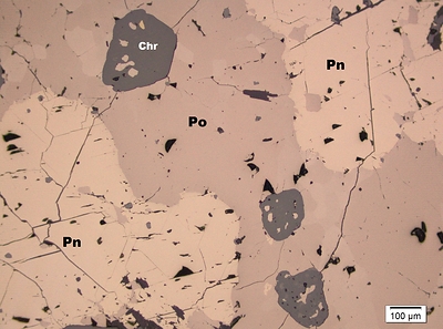 Figure 2: Massive sulphide consisting of Po, Pn and euhedral chromite.