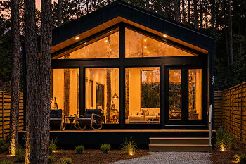 xInkwell Manor, a modern pine retreat in Santa Rosa Beach, Florida, at dusk.