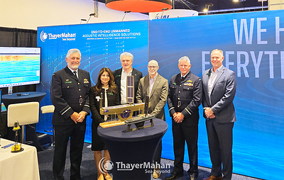 Members of the Australian Defence Force, Austrade, Ocius, and ThayerMahan at the Navy League's Sea Air Space 2026, in the ThayerMahan booth.