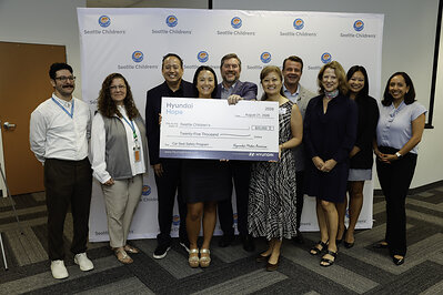 (left to right) Tony Montegna, community health education consultant, Seattle Children’s, Lara Sim, senior director, community health, Seattle Children’s, Brandon Ramirez, director, corporate social responsibility, Hyundai Motor North America, Isabell Sakamoto, manager, community health, Seattle Children’s, Jim Walen, owner and dealer principal, Seattle Hyundai, Eve Kopp, senior director, corporate giving, Seattle Children’s, Benjamin Michajlyszyn, director, Safety Test and Investigations Laboratory, Hyundai North American Safety Office, Amy Walen, state representative, Seattle, Ciara Calub, corporate social responsibility, Hyundai Motor North America, Vanessa Perez, corporate social responsibility, Hyundai Motor North America at Sand Point Way Learning Center in Seattle on August 21, 2026 (Photo/Hyundai)
