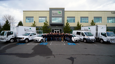 The Lake Washington Windows and Doors team in front of building
