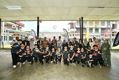 Programme participants, students, teachers and partners pose for a group photo following the drone sports programme at Sri Bestari Private School