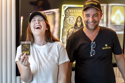Siera Osborne, Quantum TCG's first full Bitcoin winner, shows her Gold digital reward card alongside Quantum TCG Founder Franck Boubli shortly before officially claiming her full Bitcoin prize in Miami.
