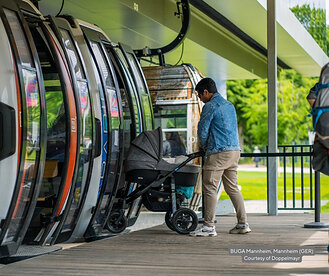 A gentlemen loads a stroller onto a gondola at BUGA Mannheim in Mannheim, Germany. Image courtesy of Doppelmayr.