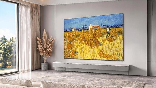 The SKYWORTH C2 Canvas Art TV displays a vibrant painting in a modern living room setting. The SKYWORTH C2 Canvas Art TV displays a vibrant painting in a modern living room setting.