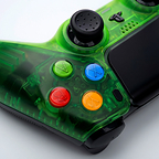 Detail of the Killscreen Duke Prime CWE showing its transparent green body, colorful ABXY-style face buttons and interchangeable thumbstick on the Xbox-inspired custom PS5 controller.