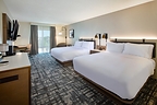 A newly renovated two-queen guest room at Crowne Plaza Bowling Green features contemporary furnishings, updated finishes and a dedicated workspace.