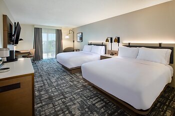 A newly renovated two-queen guest room at Crowne Plaza Bowling Green features contemporary furnishings, updated finishes and a dedicated workspace.