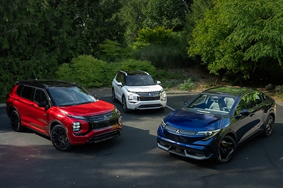 Three Green Car Journal winners in one shot!  Outlander and Outlander PHEV (left and center) shared the 2026 Green Car Journal Family Green Car of the Year, Eclipse Sportback EV (right) is the 2027 Green SUV of the Year