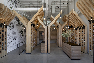OLIVE TREE PEOPLE’s first U.S. flagship on Abbot Kinney in Venice—its “cathedral to Waterless Beauty”—brings the brand’s “From Tree to Beauty” philosophy into physical form through soaring olive-tree-inspired wooden structures, Waterless Beauty displays and rammed-earth construction.