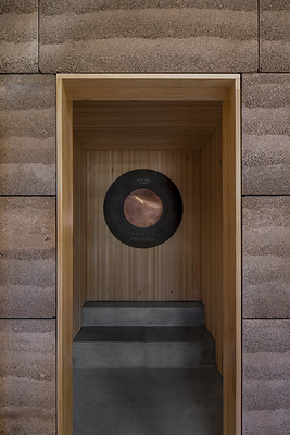 Olive re:connect, the Frequency Room at the heart of OLIVE TREE PEOPLE’s first U.S. flagship, sits within the rammed-earth architecture of its “cathedral to Waterless Beauty,” creating a space dedicated to experiencing the frequencies of the olive tree.