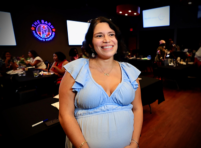 A new mother shares her experience at the luncheon