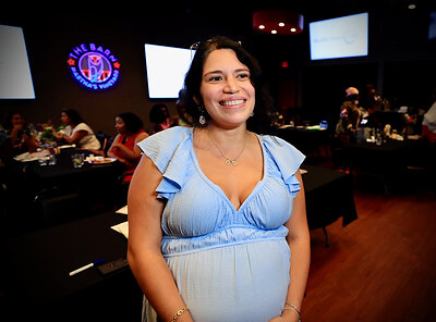 A new mother shares her experience at the luncheon