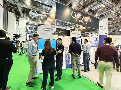 Attendees engage with Armstrong Fluid Technology representatives at the Ontario Canada Pavilion during BEX Asia 2026 in Singapore.