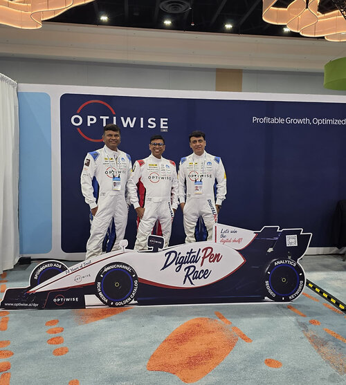 The Optiwise.ai Team at Walmart Seller Summit 2026 with the Digital Pen RaceCar