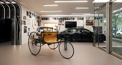 A replica of the Benz Patent-Motorwagen is placed within Mercedes-Benz Studio Toronto, spotlighting the milestone that began the Mercedes-Benz journey in 1886.