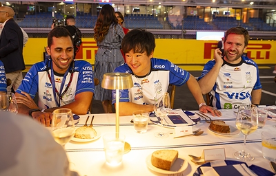 Yuki Tsunoda at La Tavolata by Barilla alongside members of the Visa Cash App Racing Bulls team.