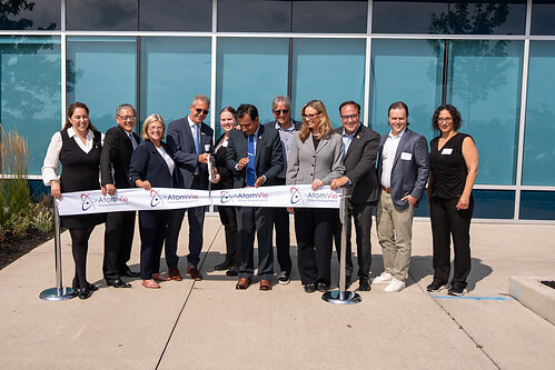 Ribbon cutting at the Grand Opening of AtomVie Global Radiopharma’s new purpose-built radiopharmaceutical manufacturing facility in Hamilton, Ontario. This image opens in the lightbox