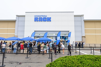 Shoppers wait in line at the new Nordstrom Rack at Colony Place in Plymouth, Mass. 