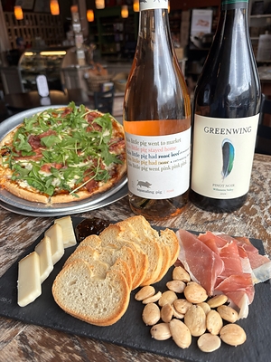 Wine and pizza pairing with charcuterie board