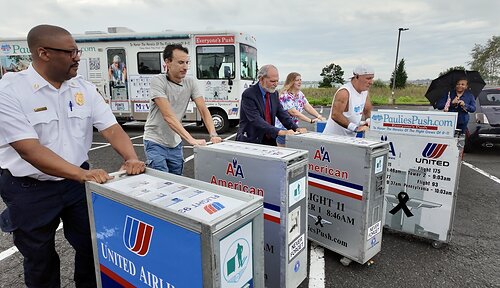 Paul Veneto is joined by the mayor of Stratford, CT and community members pushing all five beverage carts.