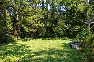 Backyard at 5280 Moore Street in Stone Mountain, Georgia, on a lot of nearly half an acre. Photo: Daniel Stabler, Quiet Street Photography.