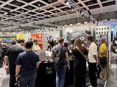 Attendees visit the AULUMU booth at IFA 2026 in Berlin to explore its award-winning technology accessories and urban carry gear.
