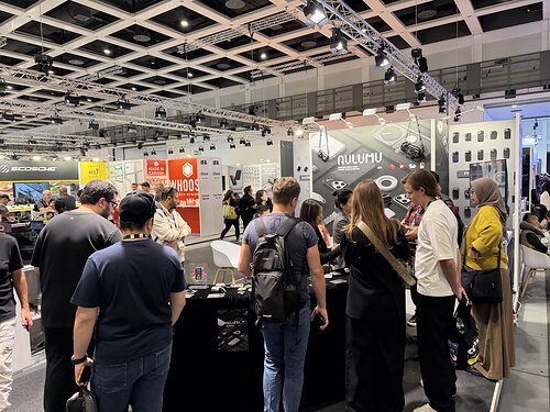 Attendees visit the AULUMU booth at IFA 2026 in Berlin to explore its award-winning technology accessories and urban carry gear. This image opens in the lightbox