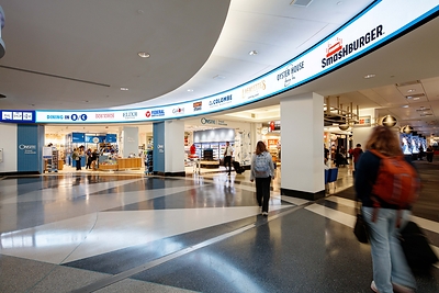 Travelers pass beneath a Watchfire indoor LED display promoting shopping options in PHL’s B/C Connector. Content can be updated in real time using Watchfire Ignite OPx. Travelers pass beneath a Watchfire indoor LED display promoting shopping options in PHL’s B/C Connector. Content can be updated in real time using Watchfire Ignite OPx.