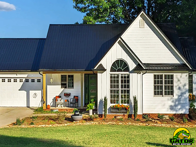 Completed installation of Gator's HeatShield Metal Roofing System in glossy black on a fall-themed Carolina home.
