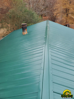 Forest Green metal roofing is perfect against an autumn backdrop on Carolina homes.