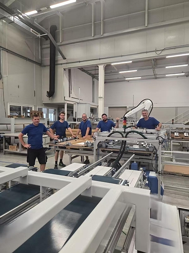 The KraftPal engineering team with the new KP25039 pallet production machine. This image opens in the lightbox