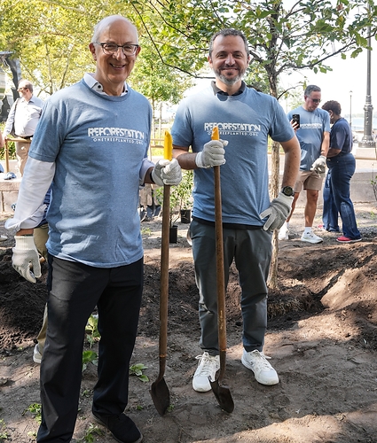 Edward Nassimi, President & Iwan Nassimi, Executive Vice President plant trees in Battery Park to support One Tree Planted Day of Service commemorating 9/11.