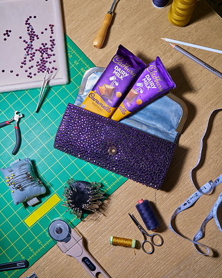 The limited-edition Cadbury Clutch, an insulated design by LUAR Founder & Creative Director Raul Lopez, that keeps chocolate cool and makes it easy to share.