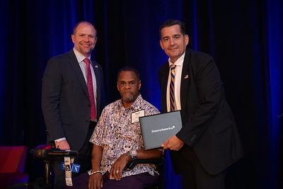 Self-advocate Devron Parker (center) from Challenge Enterprises of North Florida with SourceAmerica's Wes Tyler (left) and Rick Terrazas (right) at the 2025 Grassroots Advocacy Conference
