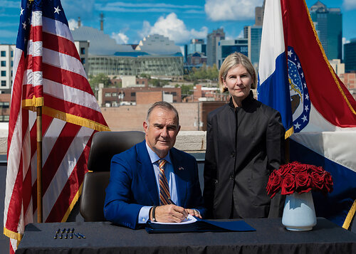 Missouri Governor Mike Kehoe joined United WE President and CEO Wendy Doyle at its Kansas City headquarters for a ceremonial signing of House Bill 2974. The new law shortens the wait for qualified professionals licensed in other states to begin working in Missouri. United WE is a nonpartisan nonprofit think-and-do tank working to strengthen the economy and democracy by increasing women's labor force participation. Missouri Governor Mike Kehoe joined United WE President and CEO Wendy Doyle at its Kansas City headquarters for a ceremonial signing of House Bill 2974. The new law shortens the wait for qualified professionals licensed in other states to begin working in Missouri. United WE is a nonpartisan nonprofit think-and-do tank working to strengthen the economy and democracy by increasing women's labor force participation.