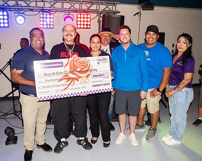 Willy Chavarria presenting the $100,000 grant to the Boys & Girls Clubs of Fresno County.