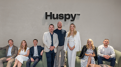 Standing (left to right): Patrick Hayden, Founder, LuxuryX, Mark Castley, CEO of Real Estate, Huspy and Georgia Peacock, with members of the LuxuryX team.