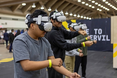 Disasterville, a mixed-reality experience from the Army National Guard, places students at the center of simulated Guard missions like earthquake relief. Students arm themselves with the jaws of life to rescue survivors and clean up debris. 